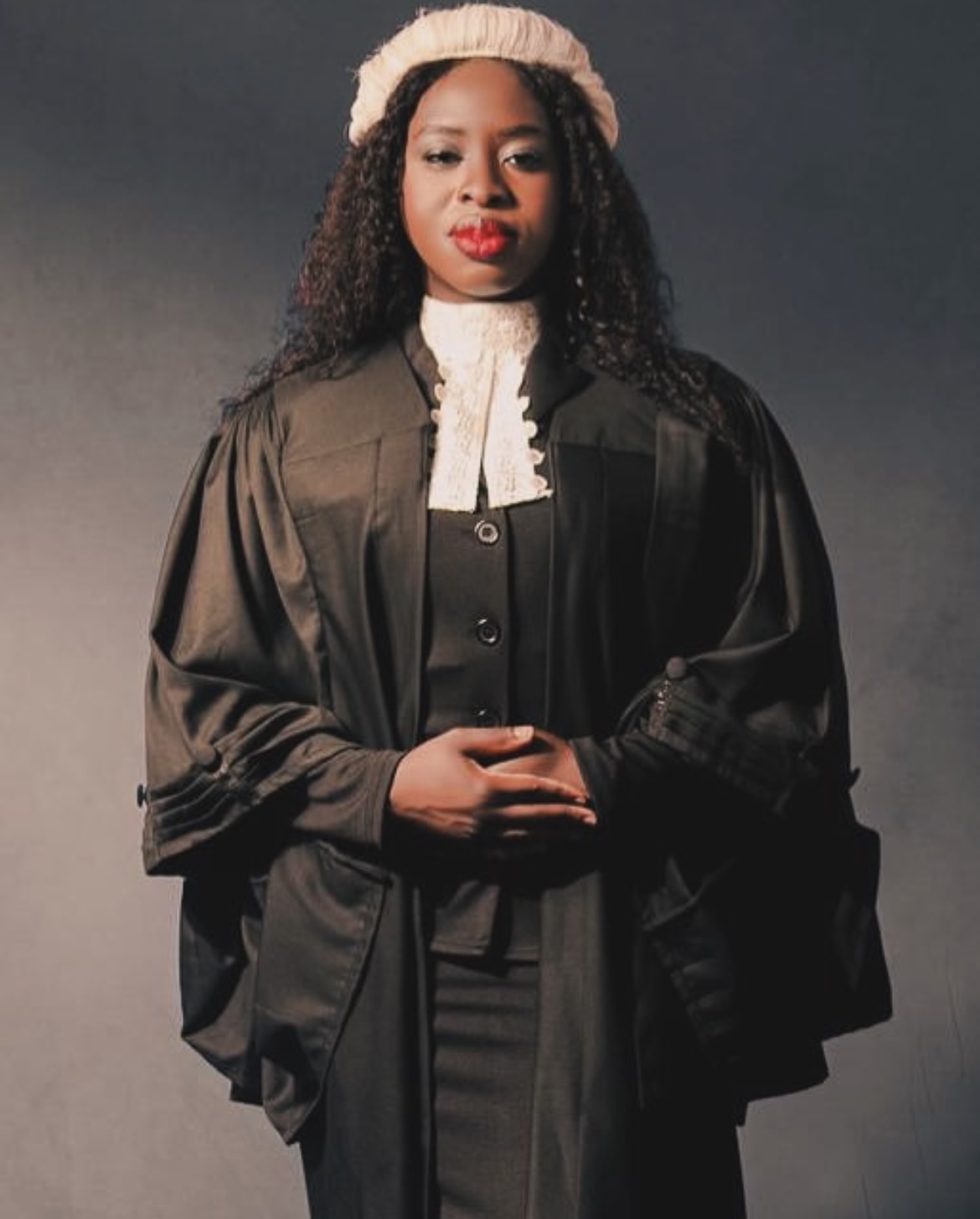 Iyabode wearing legal robes and a barrister’s wig